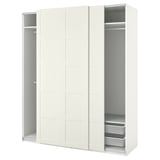 A white ikea PAX wardrobe with sliding doors and internal storage.