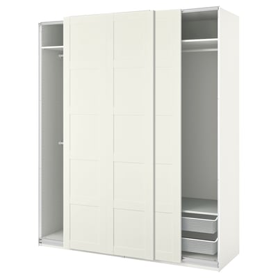 A white ikea PAX wardrobe with sliding doors and internal storage.