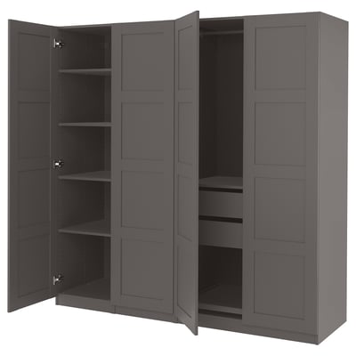 Dark gray PAX wardrobe with four open doors revealing empty shelves and compartments.