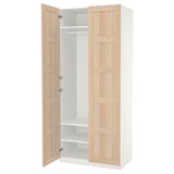 An open wooden wardrobe named PAX with light oak doors and white interior.