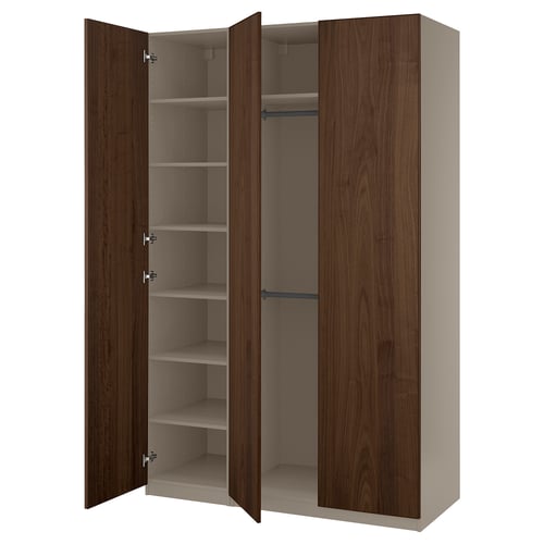 An open PAX wardrobe with dark brown wooden doors and shelves.