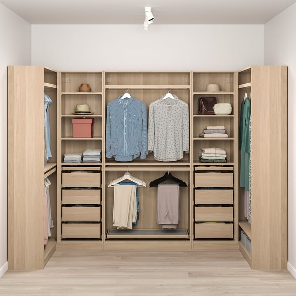Wooden closet with clothes, drawers, and shelves, spacious and organized.