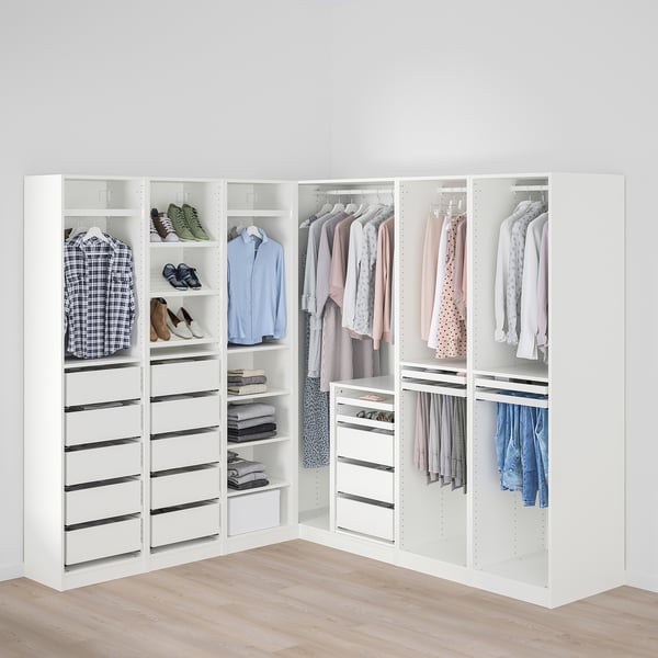 Well-organized walk-in closet with hanging rod, drawers, and shelves.