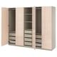This image shows an open PAX wardrobe, light pink, with drawers and shelves. Modern design for organized storage.