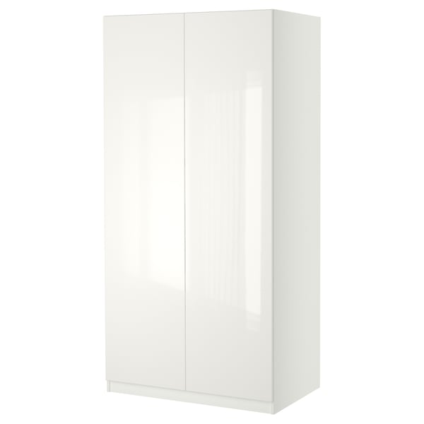 A white PAX wardrobe. It has a sleek, modern design with a glossy finish and soft-closing doors.