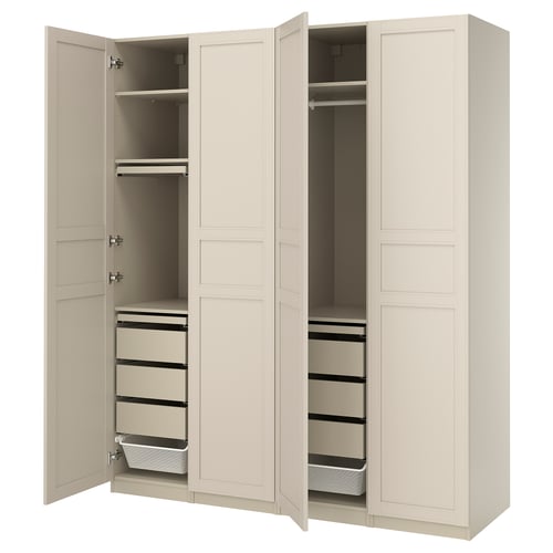 An open beige PAX wardrobe with drawers and shelves.