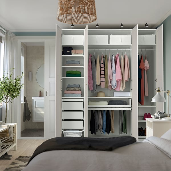 Bedroom with organised PAX wardrobe, lighting, and silent doors.