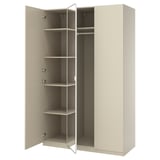 An open beige PAX wardrobe with adjustable shelves and a hanging rail.