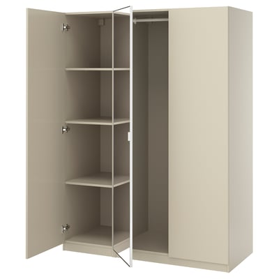 An open beige PAX wardrobe with three shelves.