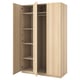 An open light wood-colored ikea PAX wardrobe. It has multiple shelves and a hanging rod inside.