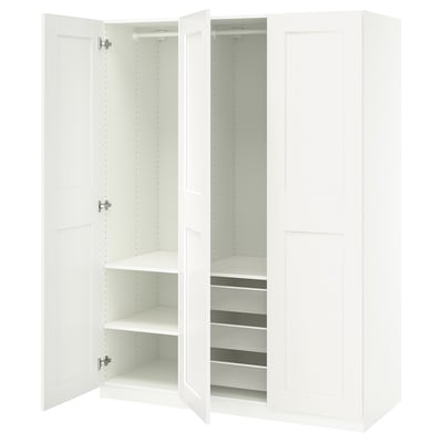 White PAX wardrobe with open doors, showing shelves, mesh drawer, and adjustable hinges.