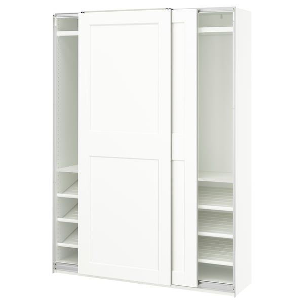 A white PAX wardrobe with sliding doors and adjustable shelves.