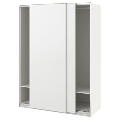 A white ikea PAX wardrobe with sliding doors and interior shelves.