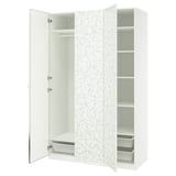 An open white PAX wardrobe with floral doors, shelves, and mesh baskets.