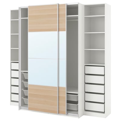 White & wooden ikea PAX wardrobe with open, adjustable shelves and mesh drawers.
