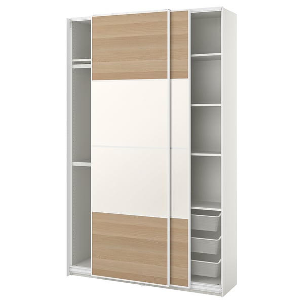 A white ikea PAX wardrobe with wooden panels and sliding doors, featuring shelves and a mesh drawer.