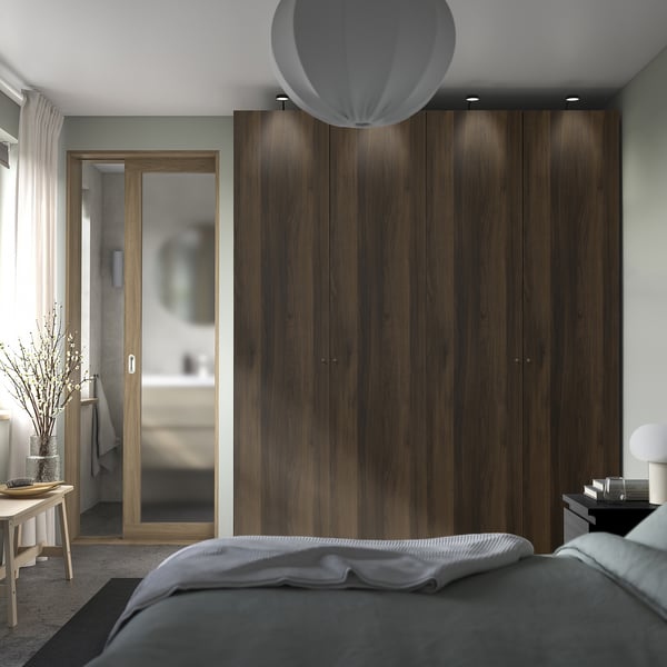 Modern bedroom with PAX wardrobe, soft-close doors, glass-paneled door, rounded ceiling light.