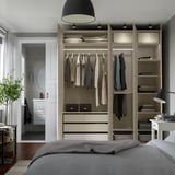Modern bedroom with built-in wardrobe, lighting, and bed. Grey bedding visible.