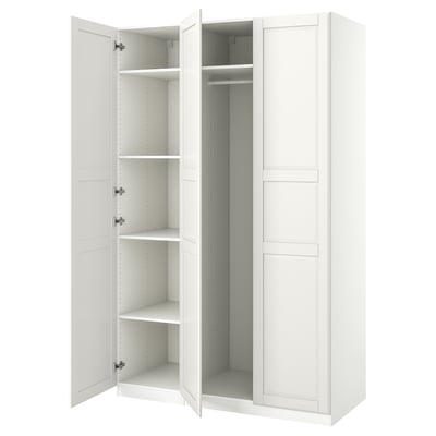 White PAX wardrobe with open doors, white interior, shelves, and hanging rail.