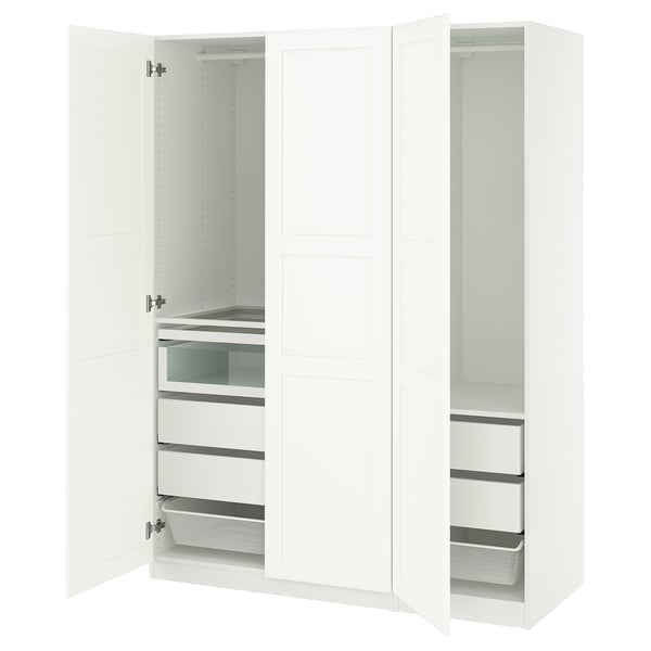 A white PAX wardrobe with drawers and shelves, open doors revealing organized storage.