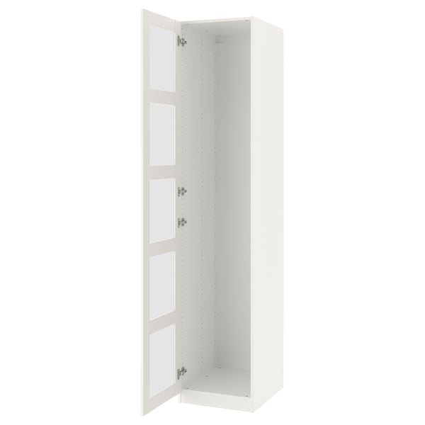 A white ikea PAX wardrobe with an open door. Its tall, narrow, and has three glass panel doors.