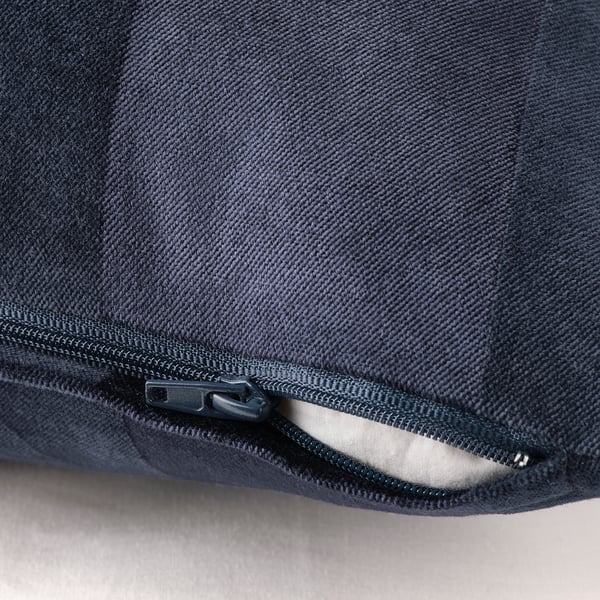 Dark blue cushion cover with zipper for easy removal, featuring matte and shiny stripe patterns.