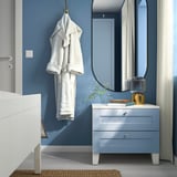 Its a PLATSA dressing table in blue. Hangs robe, mirror above, white bottom; neat and cozy.
