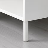 Closet leg, sturdy white metal, attached to wooden floor.