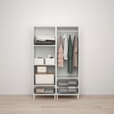 White PLATSA storage with clothes, boxes, jackets, and small items.