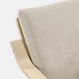 Modern, neutral-toned armchair with sleek, curved wooden design, emphasizing comfort and quality craftsmanship.