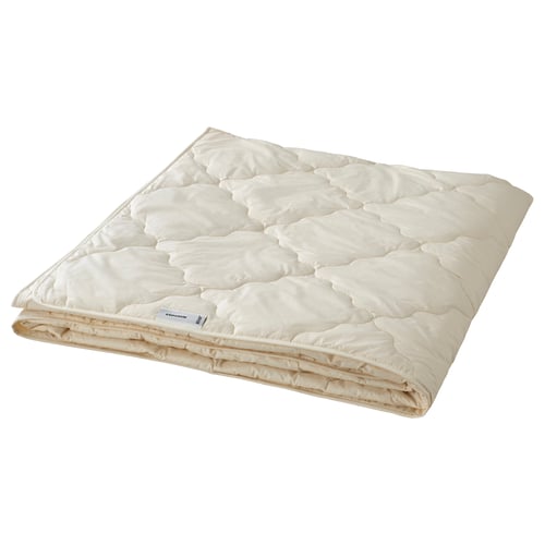 RÅDHUSVIN white wool duvet, folded, natural materials.