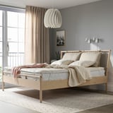 Modern bedroom with RÅDHUSVIN protector, pendant light, and large windows.