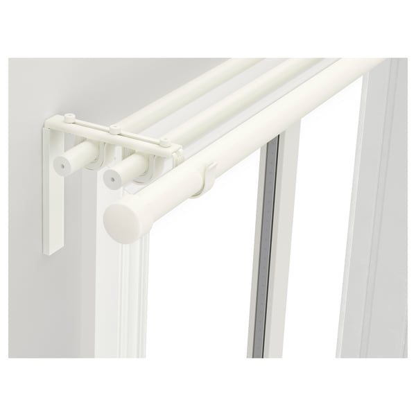 White curtain rod holder system with 3 holders and corner brackets. Flexible design.