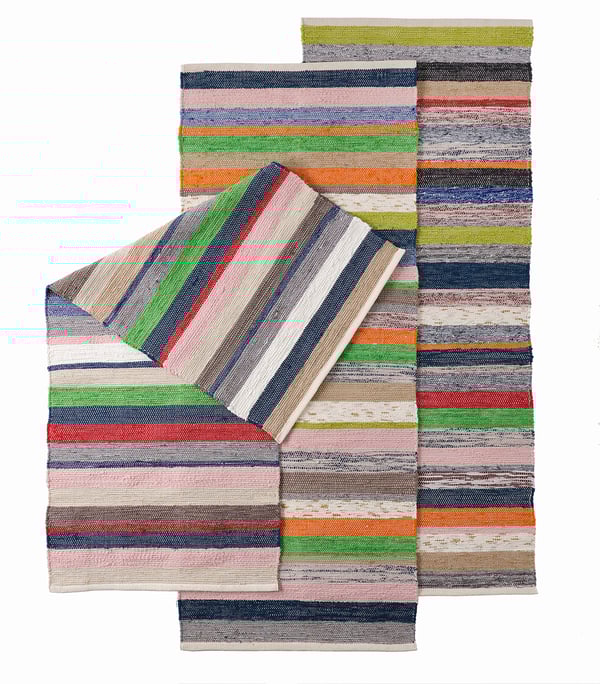 Handwoven multicolored RANGSTRUP cotton rugs with unique patterns.