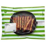 IKEA refrång vegetable sausages bag, showing cooked sausages on a pan.