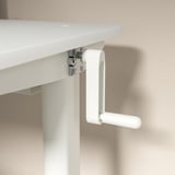 A crank handle of a white RELATERA adjustable desk. The handle allows height adjustments between sitting and standing positions.