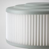 Modern lamp with pleated white shade, smooth grey top and base, showcasing quality design.