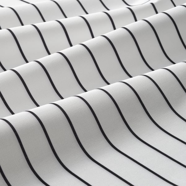 Close-up of RINNIG apron in black and white stripes, showcasing water-repellent texture and quality stitching.