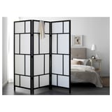 Black & white RISÖR grid divider by bed.