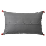 Gray rectangular pillow with red tassels, buttoned closure, embroidered pattern.