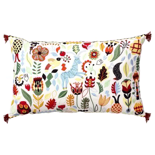 RÖDARV pillow: floral & geometric patterns in red, blue, green, yellow on white base with tassels.
