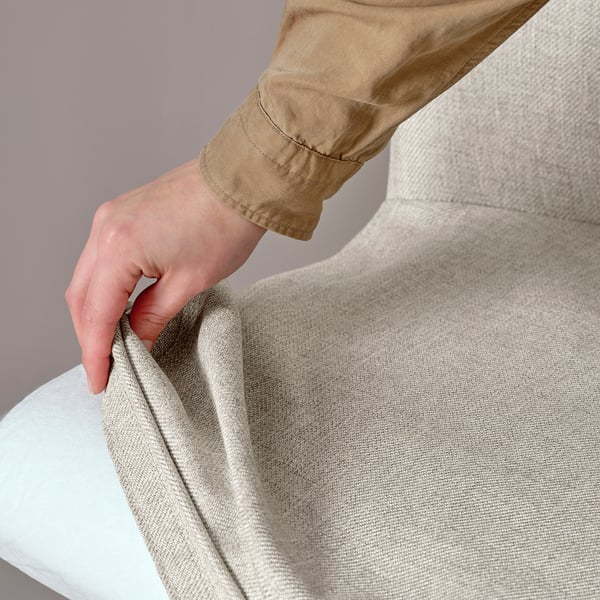 Hand grips ROSENTORP chairs soft, textured kilanda fabric, showing swivel function.