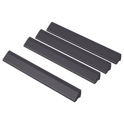 Three black rectangular plastic strips, part of RUNNEN outdoor flooring set, laid at varying angles for display.