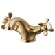 Option: Gold-colored RUNSKÄR bathroom faucet, brass material, curved design, cross handles.