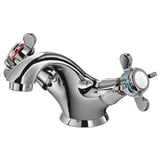 A chrome RUNSKÄR faucet with cross handles. Its sleek, durable, and ceramic discs for long-lasting use.