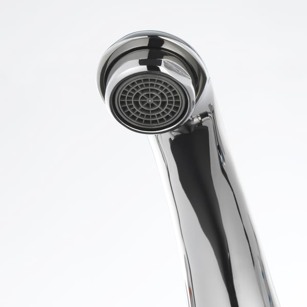 Modern chrome faucet with precision-engineered aerator, ensuring durability and efficient water flow.