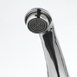 Modern chrome faucet with precision-engineered aerator, ensuring durability and efficient water flow.
