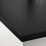 Close-up of sleek black speckled countertop, smooth and sturdy, showcasing its wipe-clean surface.