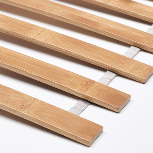 Close-up of wooden slats on a sturdy, well-crafted bed frame.