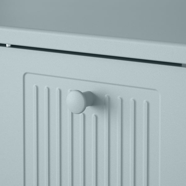 Modern storage cabinet with rounded door knobs and grooved design, highlighting quality and stylish details.